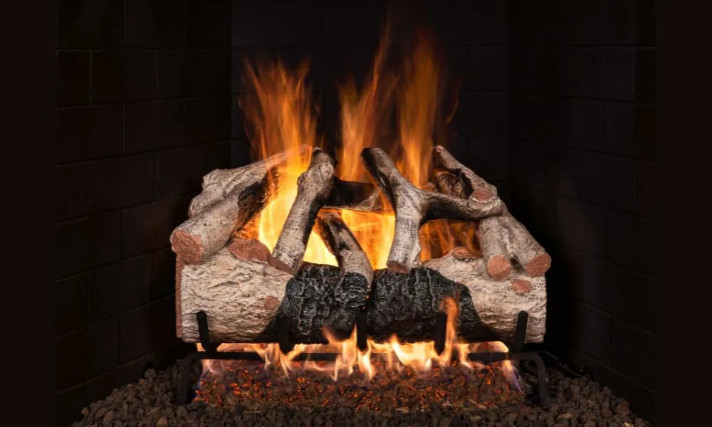 A Real Fyre charred mountain birch gas log set burning in a masonry firebox