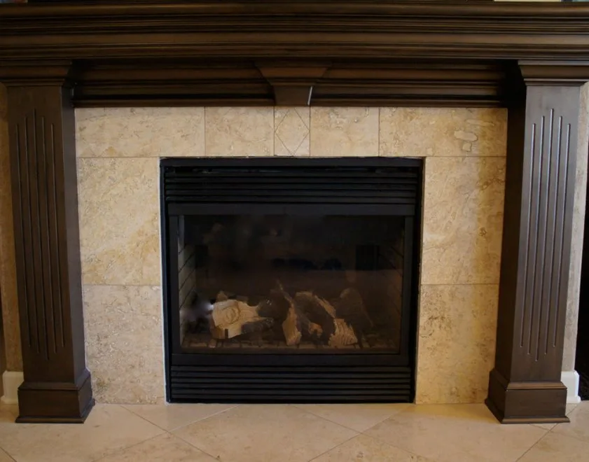 A tiled fireplace surround before its renewal, from our project gallery