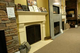 A wall of fireplace displays in the Overland Park showroom